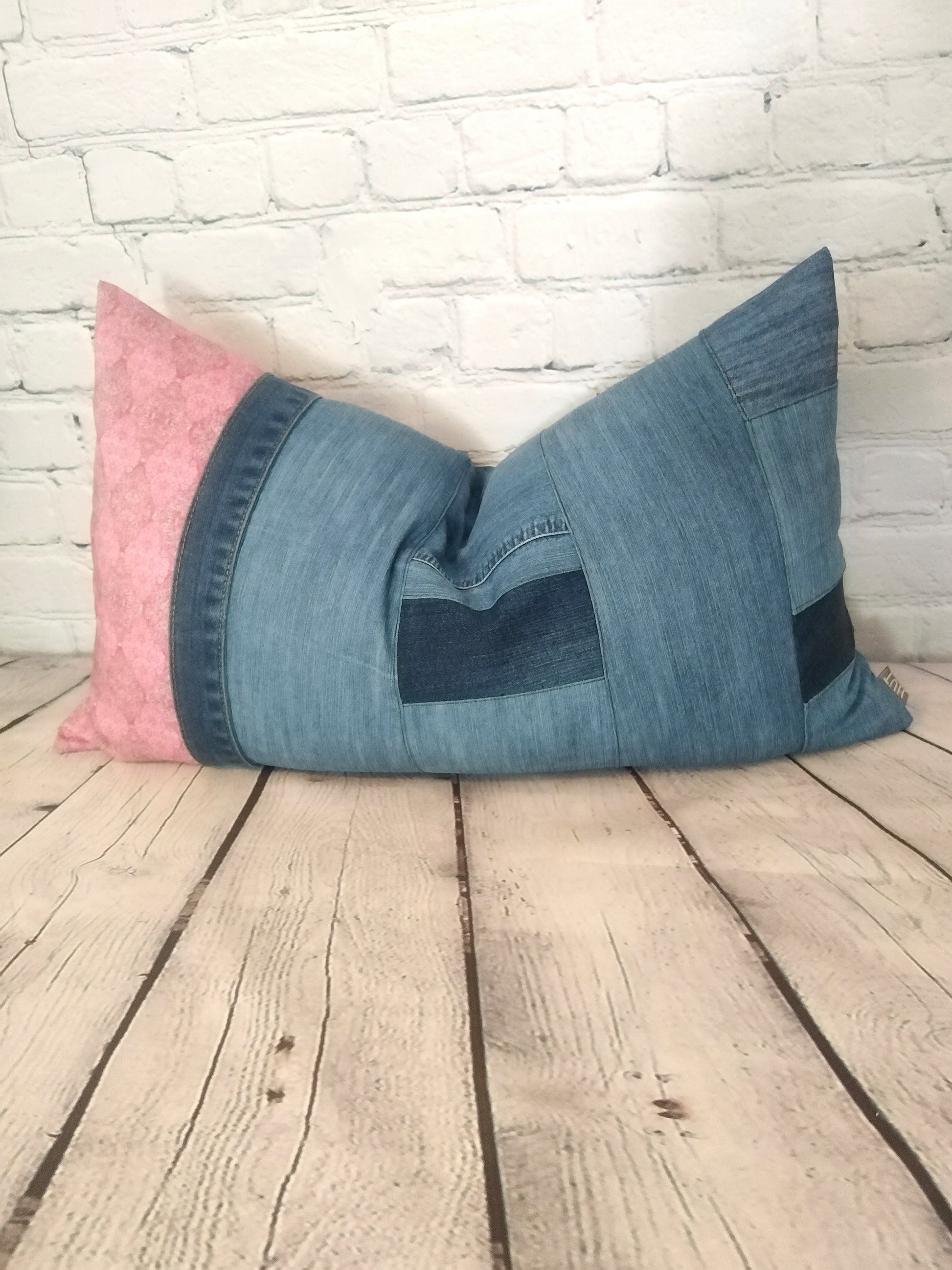 Handmade vintage denim and pink Liberty lawn patchwork bolster cushion.